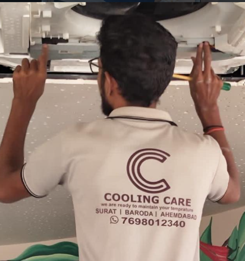 Cooling Care technician servicing a cassette AC unit